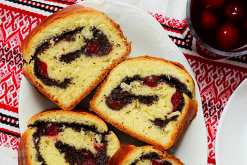 Yeast roll with poppy seeds and cherrie.top veiw