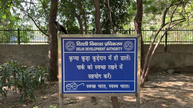 Sign in Picnic hut Park in Ashok Vihar, Delhi, India on a sunny day