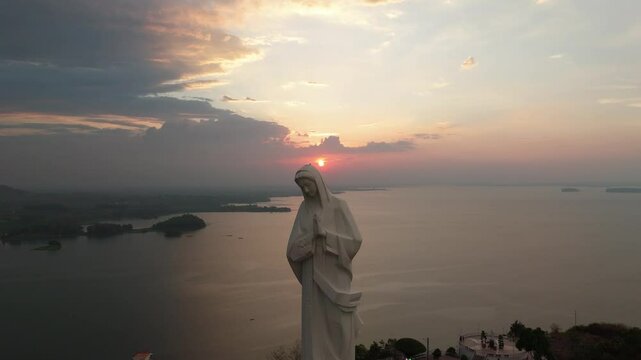Drone footage of the Our Lady of Nui Cui Pilgrimage Center against dusk sky at sunset in Vietnam