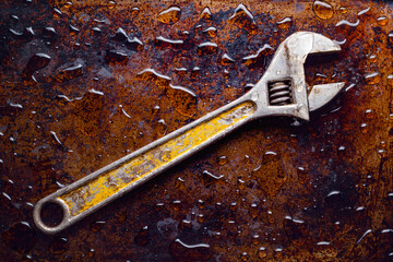 Adjustable wrench or spanner on wet metal