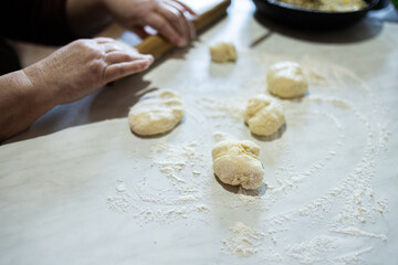 Dough for homemade pies. Yeast dough for pies. Grandma makes pies.