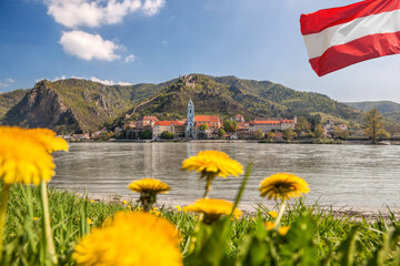 Dürnstein village with Austrian flag during spring time in Wachau, Austria