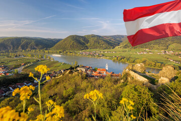 Dürnstein village with Austrian flag during spring time in Wachau, Austria