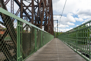 Obraz premium Old railway bridge and Vltava river in Prague