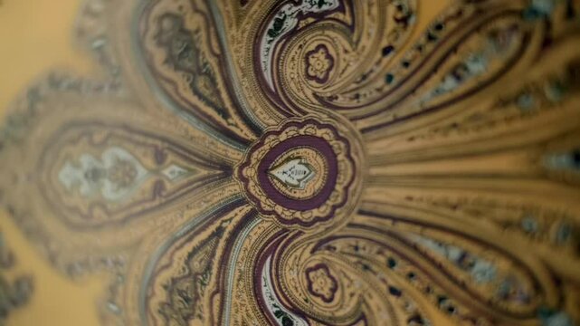 Fabric with beautiful asian patterns flutters in the wind. Closeup. Macro. Slow mo, slow motion, high speed camera, 200fps