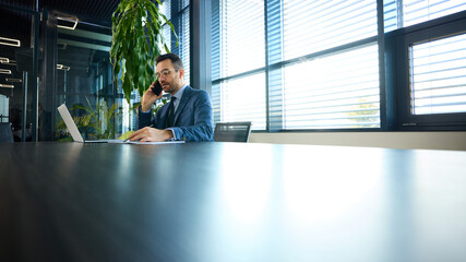 Ambitious professional engaging in corporate communication while managing projects remotely. Concept of digital business, connectivity, strategic thinking, leadership.