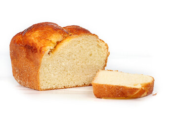 Homemade brioche cut in half on a white background