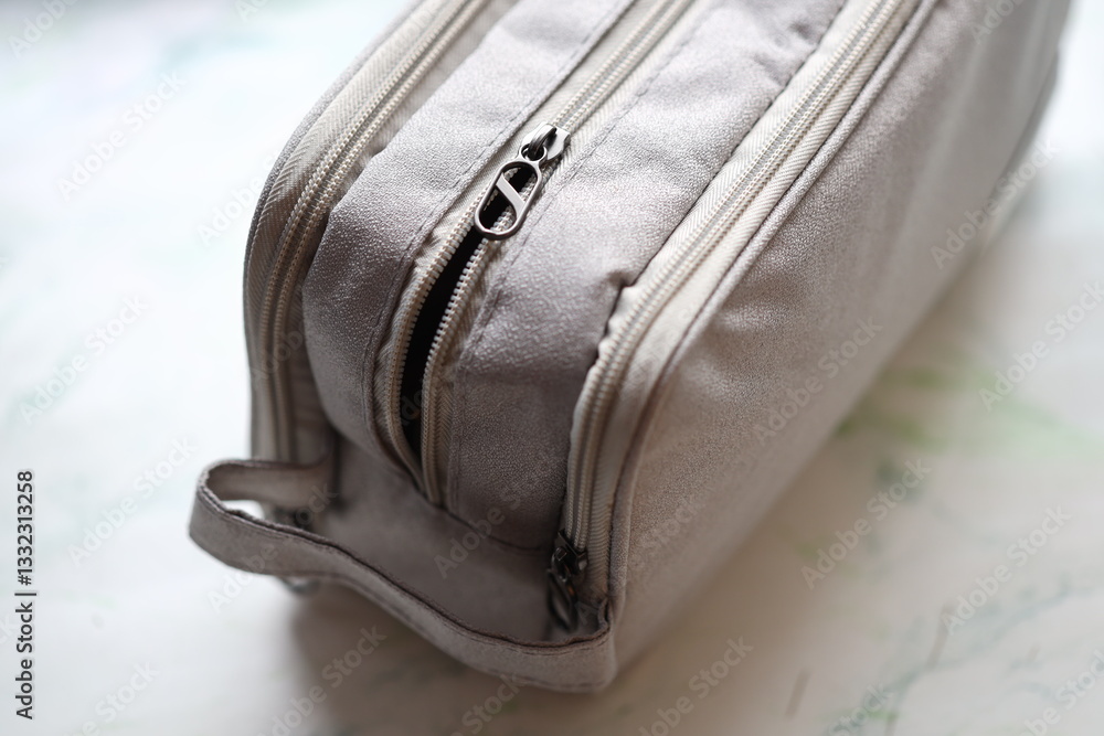 Poster a detailed view of a bag sitting on a table, ready to be packed or unpacked.