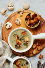 Creamy champignon soup with croutons.top veiw