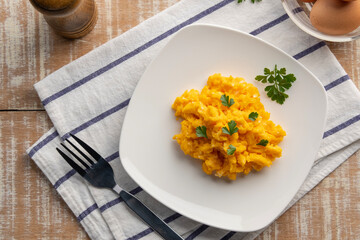 Scrambled eggs in white plate.for healthy breakfast,simple food.Top view with copy space.