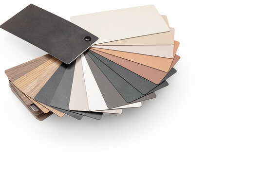 Catalog of samples of materials for the manufacture of furniture from chipboard on white background with copy space, including clipping path. Color guide displaying a range of hues for use in interior
