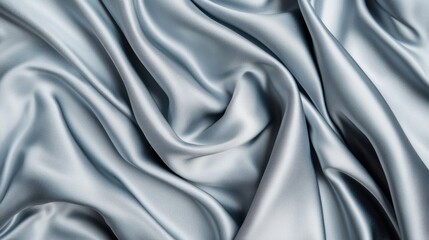 Obraz premium A piece of fabric with a silver color and a very smooth texture