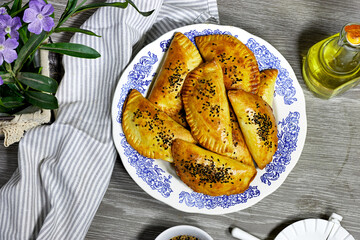 Tuna turnover, homemade, with cheese and other ingredients, freshly baked