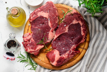 Raw beef  steak with spices and olive oil .style hugge.top veiw