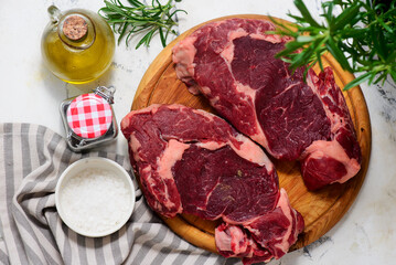 Raw beef  steak with spices and olive oil .style hugge.top veiw