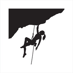 Silhouette of a person rock climbing on a cliff
