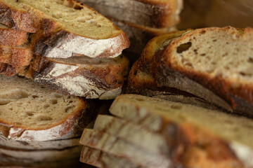 Close-up of rustic sourdough bread slices, perfect for bakery or food blog.