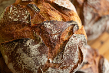 Close-up of rustic sourdough bread, perfect for bakery websites and food blogs.