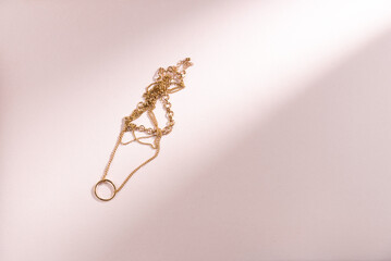 Necklaces on a pink background. Flat lay, top view. Copy space