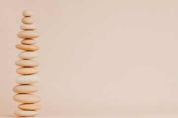 A balanced stack of smooth stones on a soft pastel background.
