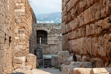 View of the stone walls of the old ancient crusader castle in the historic city of Byblos. The city...