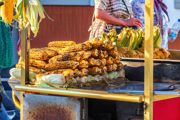 Boiled and fried corn lies on the counter of one of the street stalls in the center of Istanbul. Turkey.