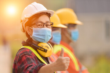 Male worker building house at construction site