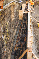 Builders prepare rebar for foundational work