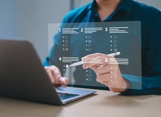 assessment survey online. Businessman with evaluating questionnaire on online laptop computer....