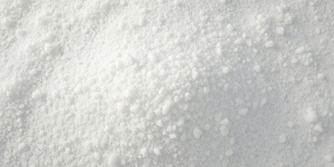 Obraz premium A large pile of fine granulated white sugar, filling the frame, granulated sugar, sweetner, pile