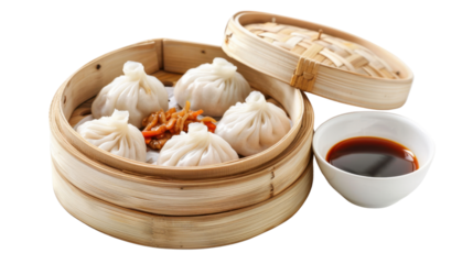 Steaming hot dumplings served in a traditional bamboo steamer with soy sauce