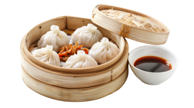 Steaming hot dumplings served in a traditional bamboo steamer with soy sauce