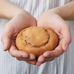 A little bread hold in two hands, wheat, food, spring