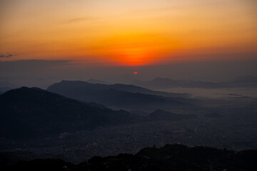 Stunning Sunrise Over Pokhara Valley with Layers of Hills and Misty Landscape from Sarangkot, Nepal