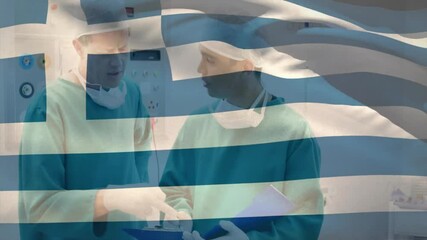 Discussing over Greek flag overlay, doctors in surgical attire in hospital - Powered by Adobe