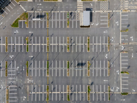 Top-down aerial view of empty car parking lots.