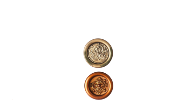 Two decorative metallic buttons with floral design on transparent background