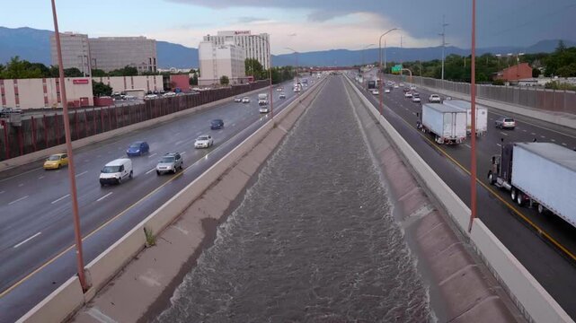 Slow Motion Rushing Arroyo Full Of Water in Uptown Albuquerque NM