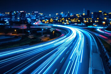 Futuristic highway with glowing blue and red light trails at night.