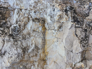 Natural rocky surface with intricate patterns and textures in beige tones, beauty of geological formations