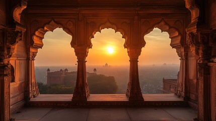 A beautiful sunrise view from the Red Fort in New Delhi, India, seen through the three arches of an ancient temple with ornate carvings. 