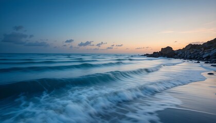 Obraz premium Serene Twilight Embraces The Oceans Gentle Caress On A Tranquil Shore With Soft, Blue Hues And A Peaceful Sunset