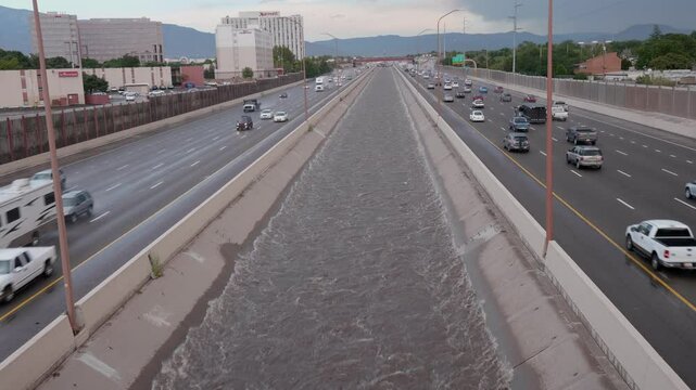 Rushing Arroyo Full Of Water in City