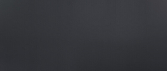 Dark textured background with subtle gradients, perfect for graphic design, web backgrounds, advertising, and creative projects. Abstract gloomy surface.