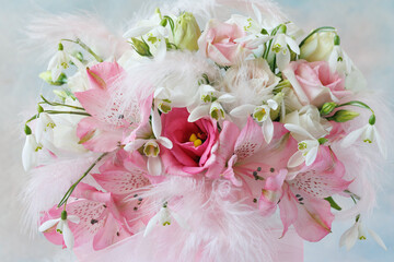 Spring delicate pink and white bouquet with lisianthus, eustoma, alstroemeria, snowdrops and feathers. Beautiful feminine card