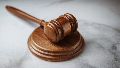 Wooden gavel on marble surface. Judge's hammer. Law and justice concept, constitution, courtroom