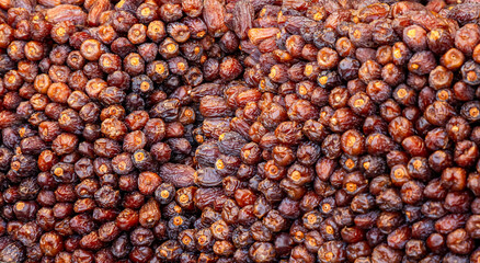 A close-up of fresh dates at a market in Istanbul, Turkey. A traditional and nutritious fruit, commonly eaten during Ramadan to break the fast, showcasing rich textures and natural sweetness.
