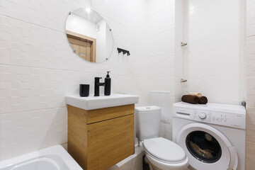 modern bathroom room with toilet and washing machine
