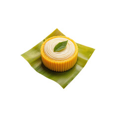 Fresh and creamy mango mousse dessert with bright yellow color and mint leaf on a leaf plate