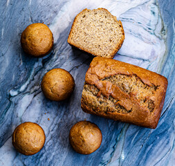 Homemade Banana Bread and Muffins on Marble Surface